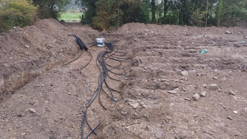 Pipes for the ground loop being laid